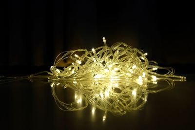 Close-up of illuminated light bulb