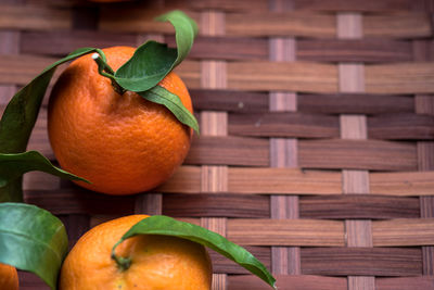 Close-up of orange fruits in basket