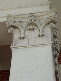 Low angle view of statues on building wall