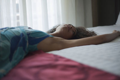 Woman sleeping on bed