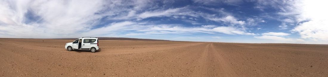 View of car on desert land