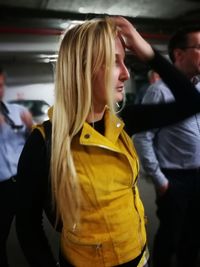 Close-up of woman standing in basement