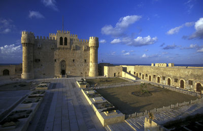 Buildings in city against sky