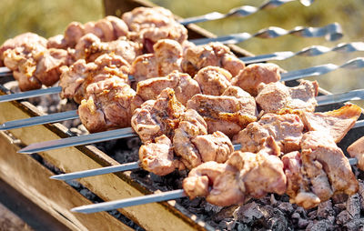 Close-up of meat on barbecue grill