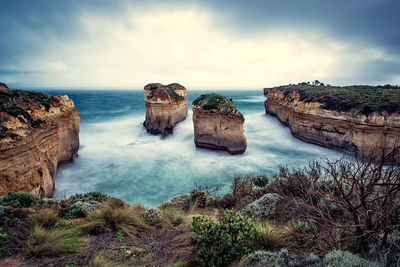 Scenic view of sea against cloudy sky