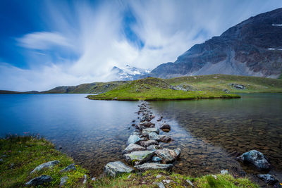 Scenic view of lake and mountains against sky