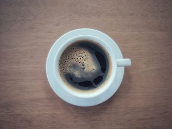 High angle view of coffee cup on table