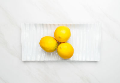 High angle view of yellow fruits on table