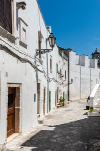 Narrow street amidst buildings in town