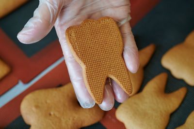 Cropped hand of woman holding heart shape