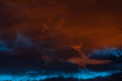 Low angle view of dramatic sky at night