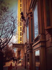 Buildings against sky at sunset