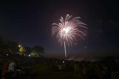 Firework display at night