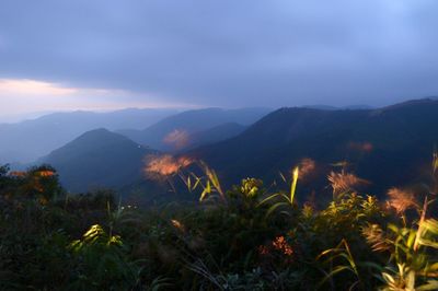 Scenic view of mountains against sky during sunset