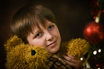 Close-up of boy with stuffed toy 