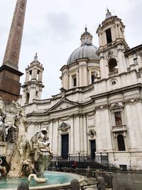 Statue of historic building against sky