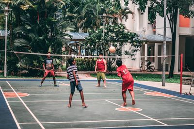 People playing basketball court