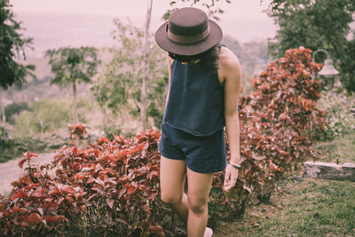 Woman wearing hat on field