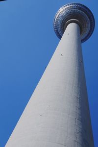 Low angle view of communications tower against sky