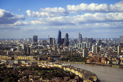 Aerial view of modern buildings in city against sky