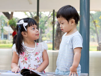 Mother and girl looking at camera