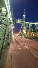 View of bridge in city at night