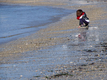 Woman walking on beach