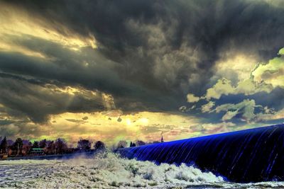 Scenic view of dramatic sky during winter