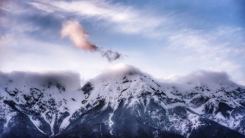 Scenic view of snowcapped mountains against sky