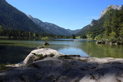 Scenic view of lake and mountains against sky