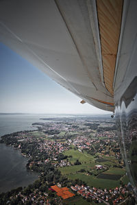 High angle view of sea and buildings against sky