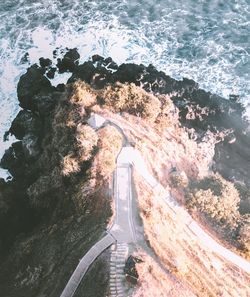 High angle view of road by sea