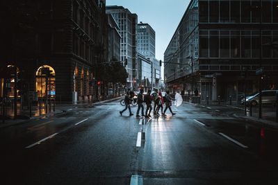 People on city street during rainy season