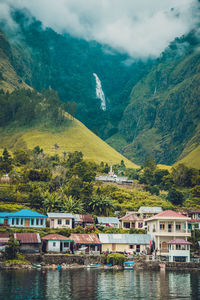 Scenic view of lake and mountains against sky