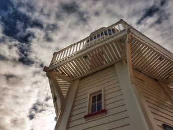Low angle view of built structure against cloudy sky