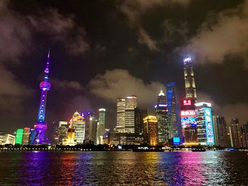 Illuminated buildings in city at night