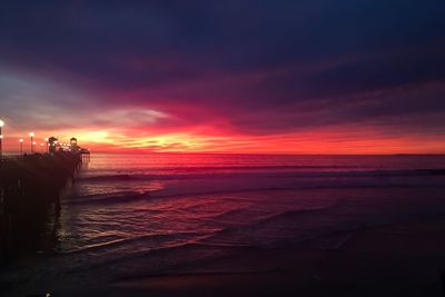 Scenic view of sea against orange sky