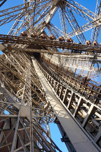 Low angle view of metallic structure against sky