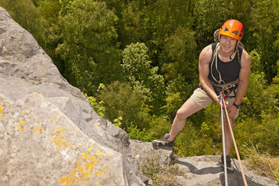 Man rappelling of cliff in south wales