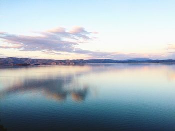Scenic view of lake at sunset