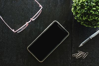 Directly above view of mobile phone on table