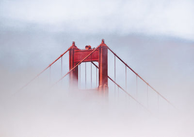 View of suspension bridge in foggy weather