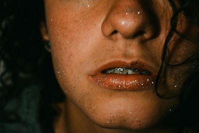 Cropped image of woman with glitter on face