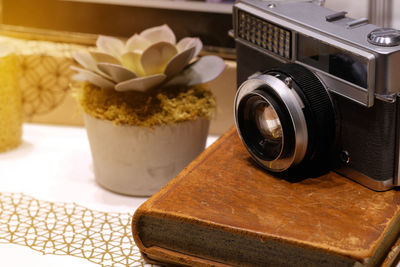 Close-up of camera on table