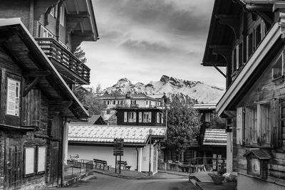 Buildings in town against sky