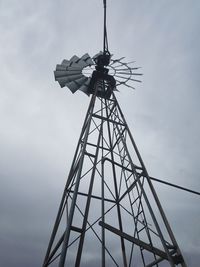Low angle view of communications tower against sky