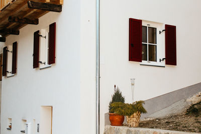 Residential building by street against sky