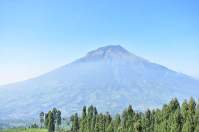 Scenic view of mountains against clear blue sky