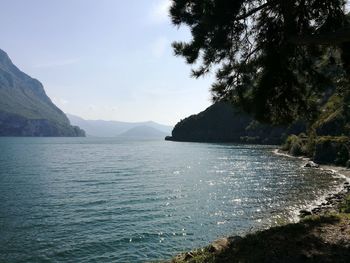 Scenic view of lake and mountains against sky