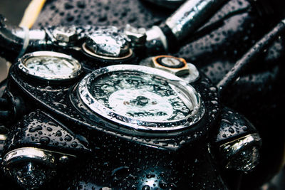 Close-up of wet motorcycle